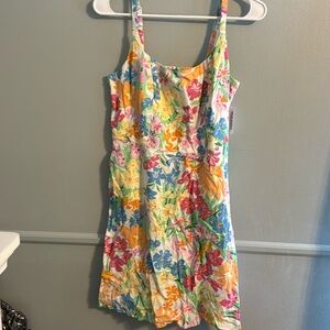 Women’s size medium sundress with adjustable straps. New with tags